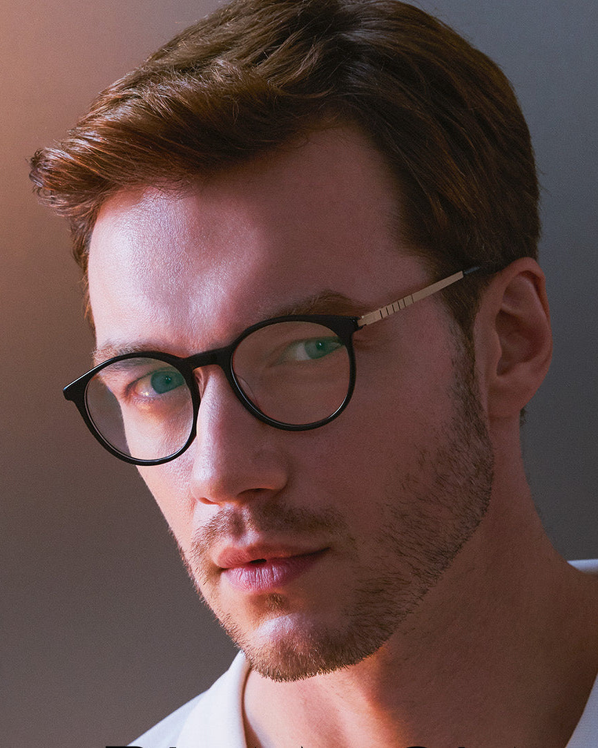 Man wearing glasses with 'Blancia Milano' branding