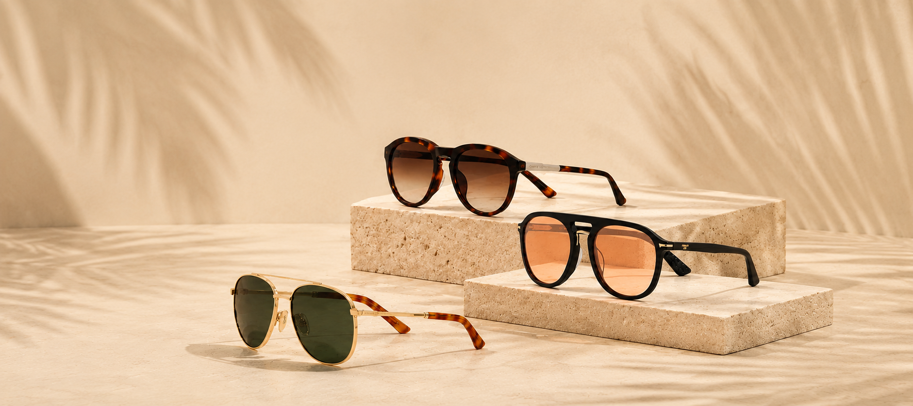 Three pairs of sunglasses on a beige background